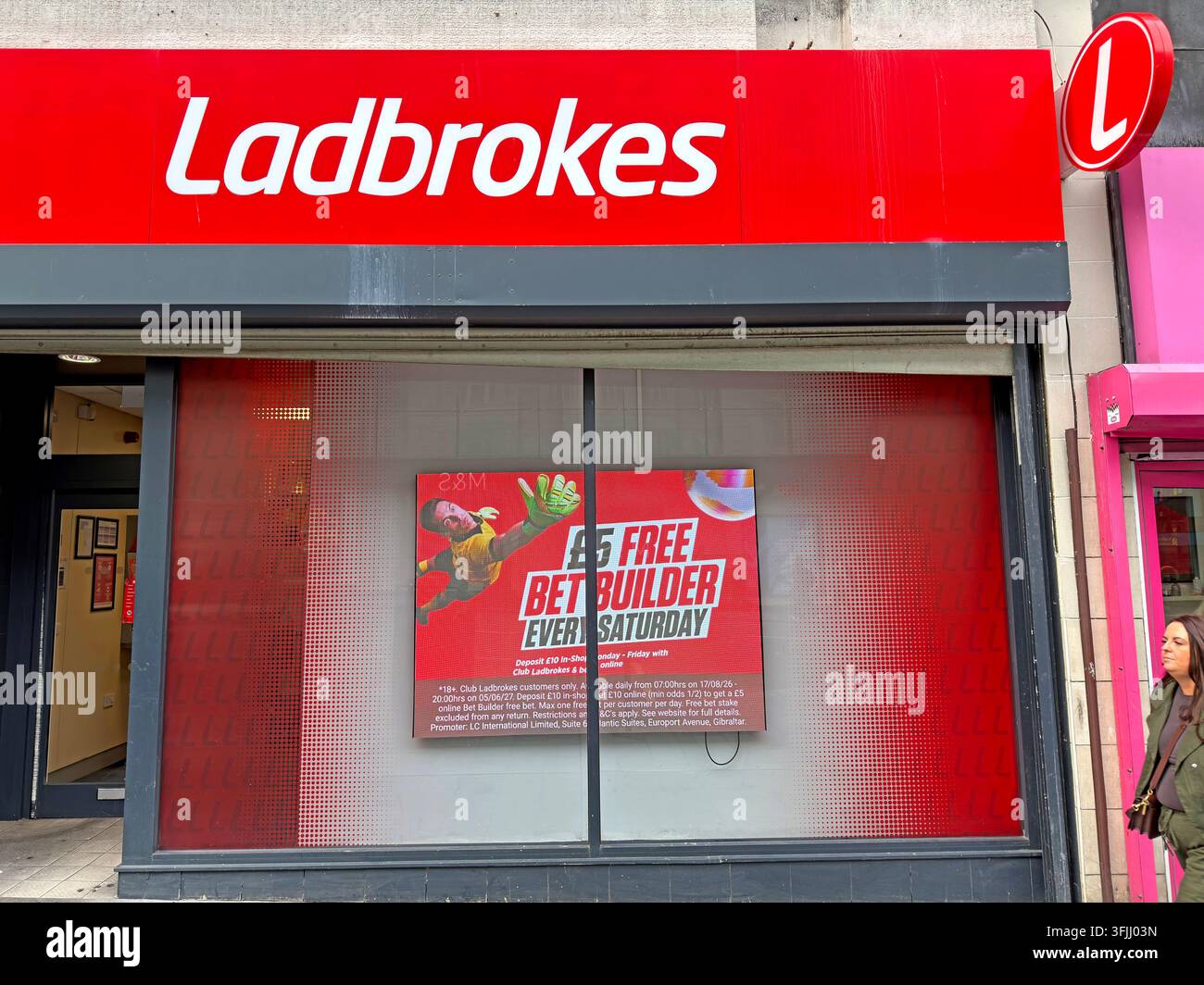 Ladbrokes betting shop on Lord Street, Liverpool, showing the national bookmaker’s red high-street branding. Stock Photo
