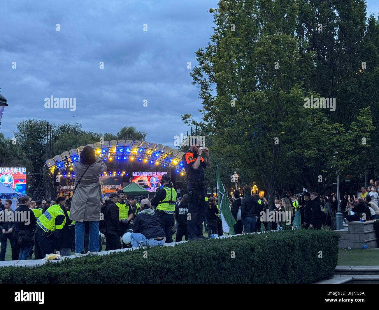 Stockholm, Sweden - September 12, 2026, police officers present at the Sverigedemokraterna campaign finale in Kungsträdgården. - Smartphone Captured Stock Image
