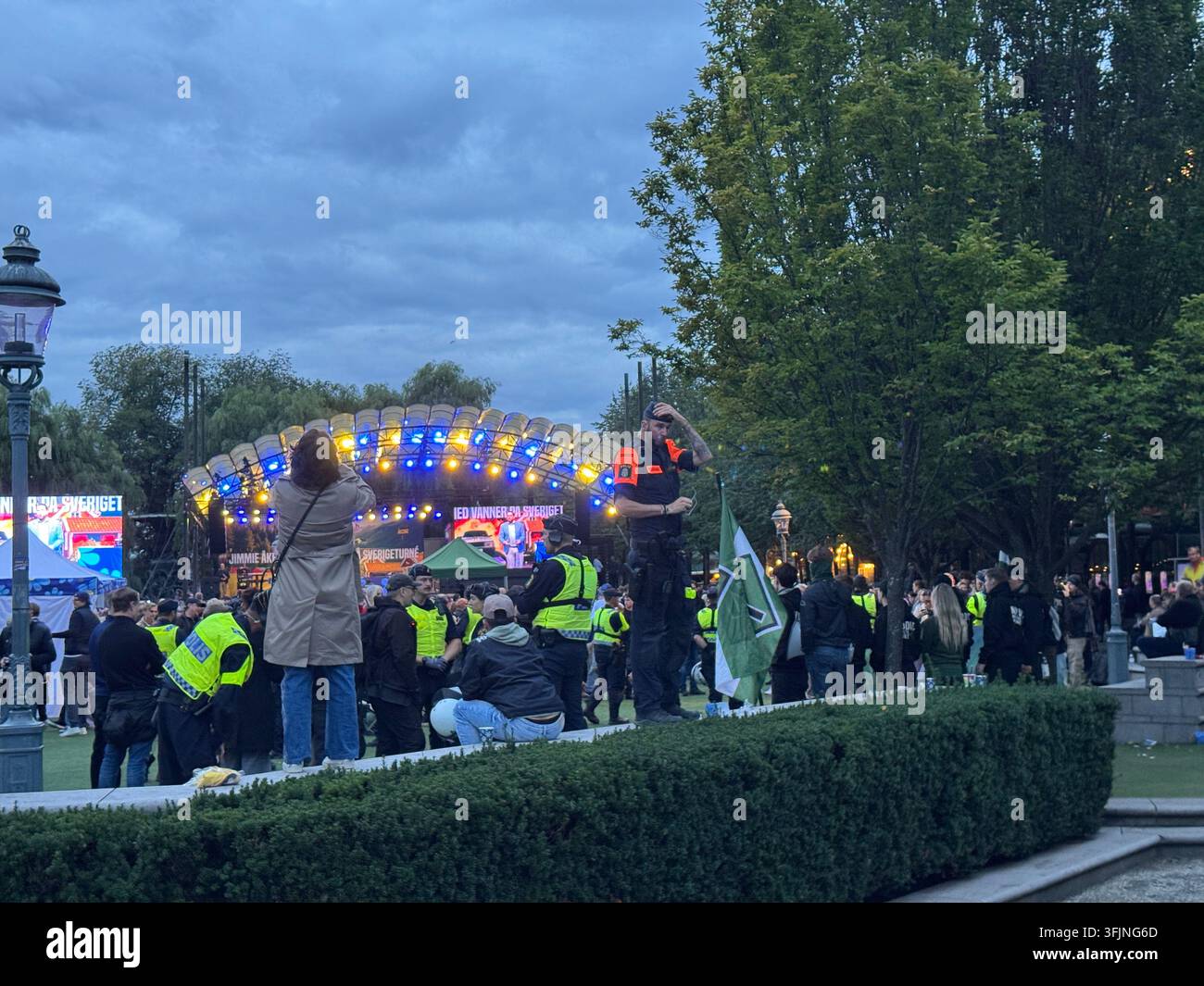 Stockholm, Sweden - September 12, 2026, police officers present at the Sverigedemokraterna campaign finale in Kungsträdgården. - Smartphone Captured Stock Image