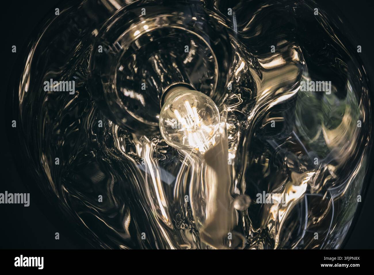 Distorted pendant light, creating abstract effect Stock Photo