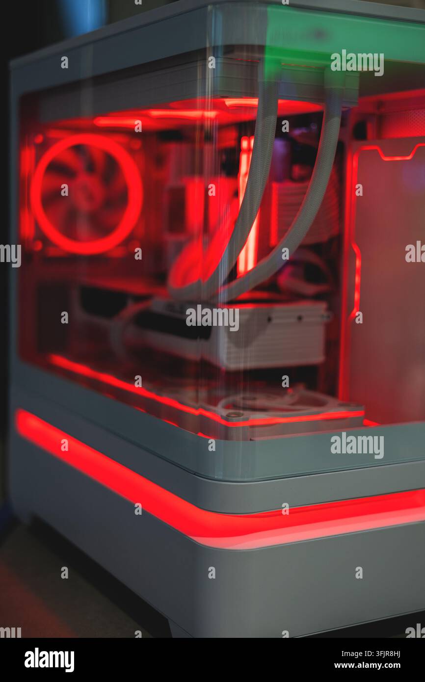 Modern computer system unit with red backlight Stock Photo