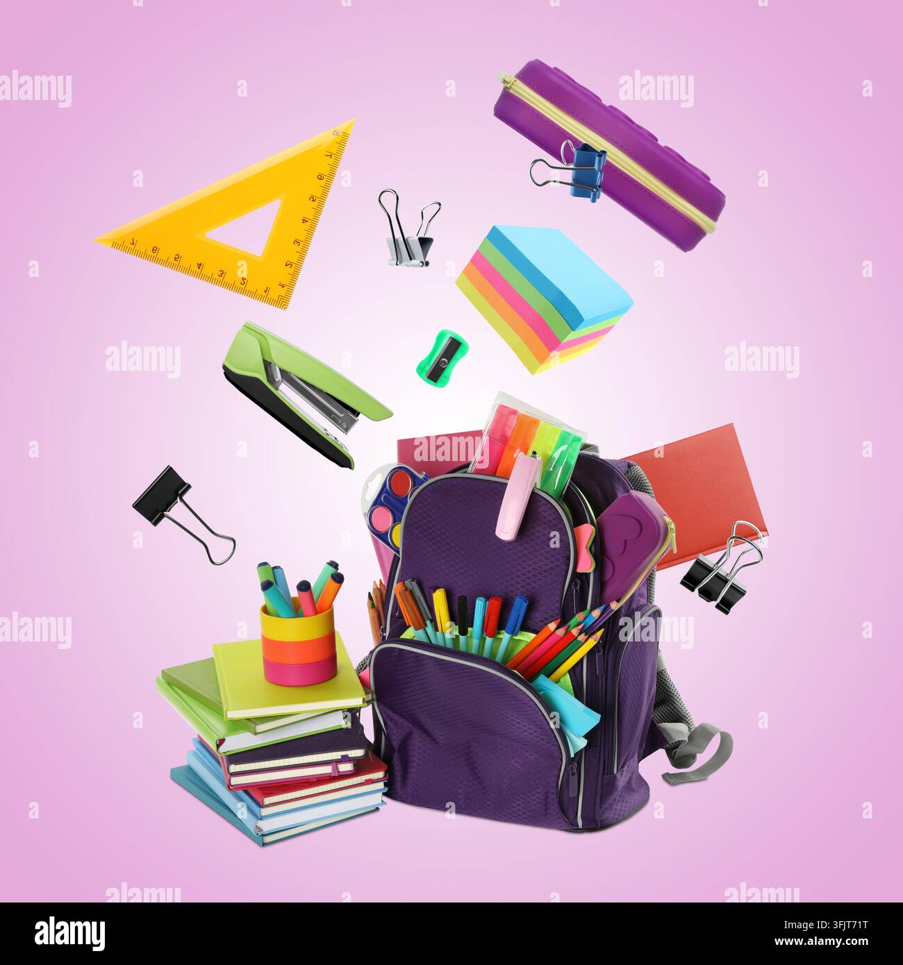 Stationery flying over backpack against color gradient background Stock Photo