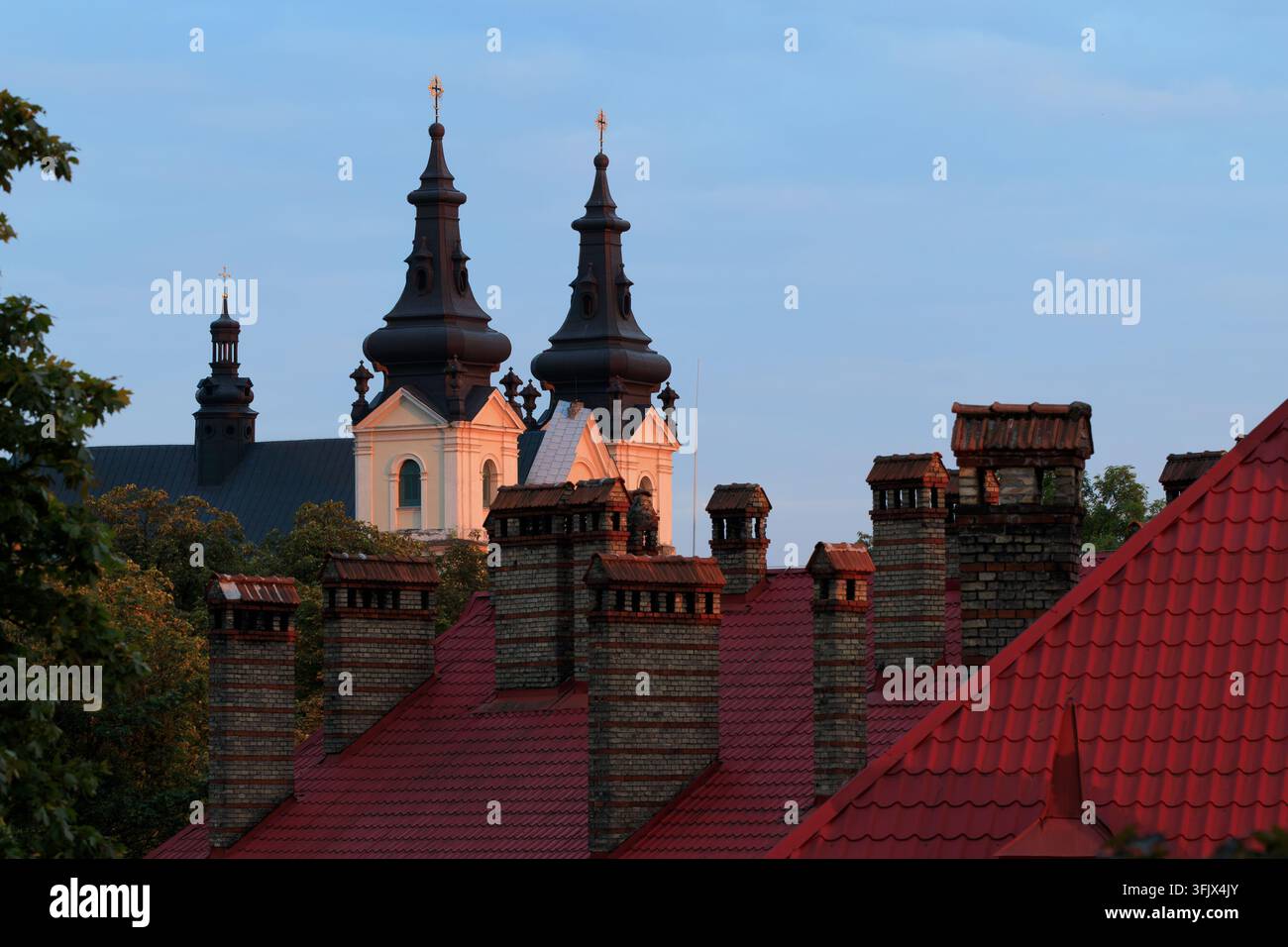 Europe architecture evening sunset time tower spire of church and roof ...