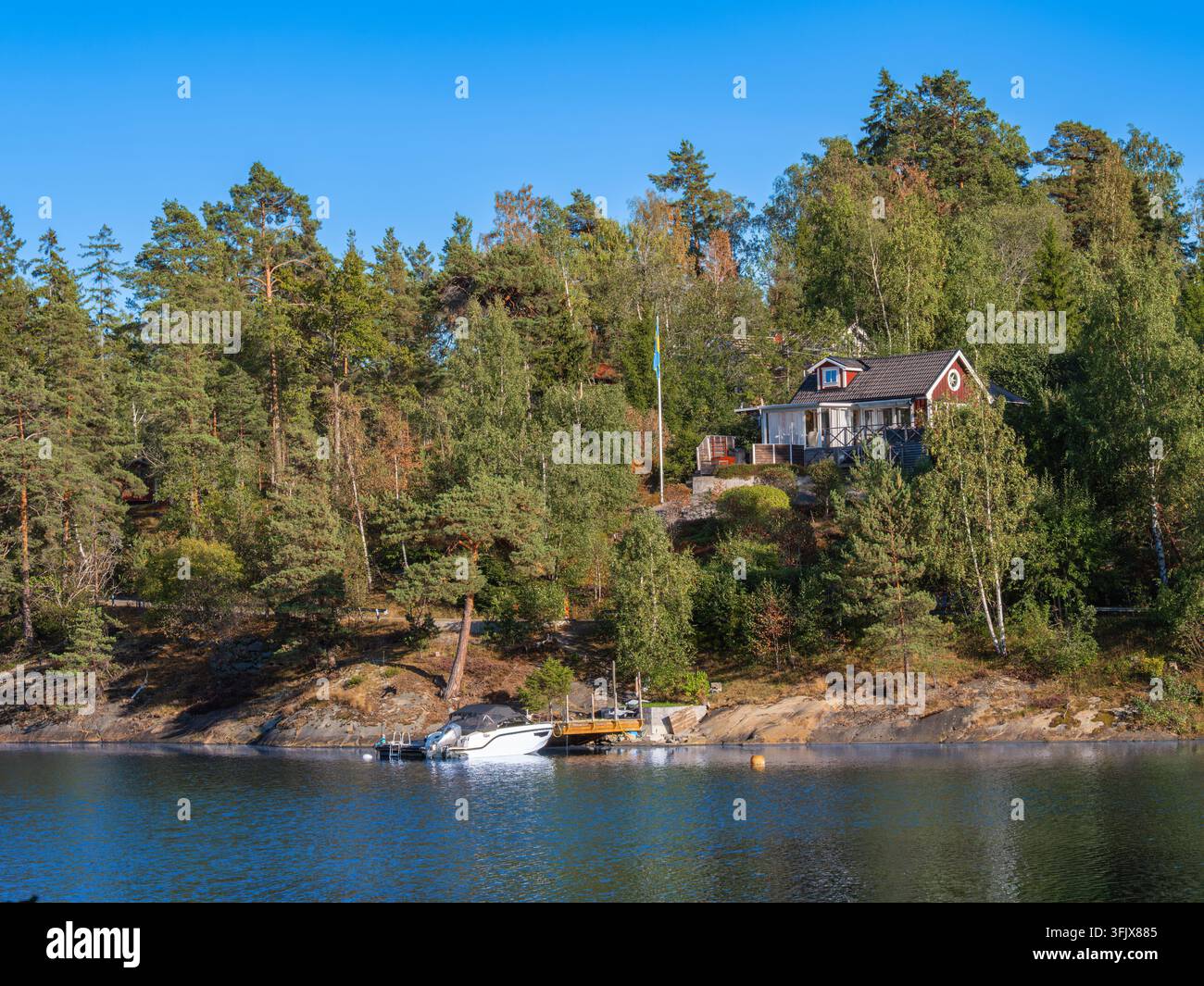 Tynningo, Sweden - 27 August 2026: Red wooden cottage surrounded by ...
