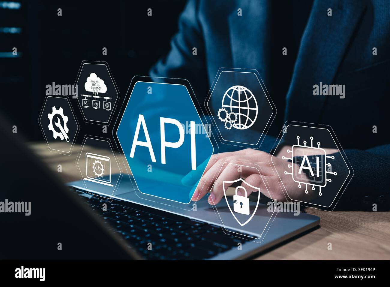 API integration technology connects software, cloud platforms, AI systems, secure networks. Professional using laptop with automation, cybersecurity, Stock Photo