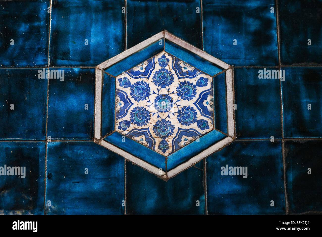 Blue floral ceramic tile pattern with geometric design Stock Photo