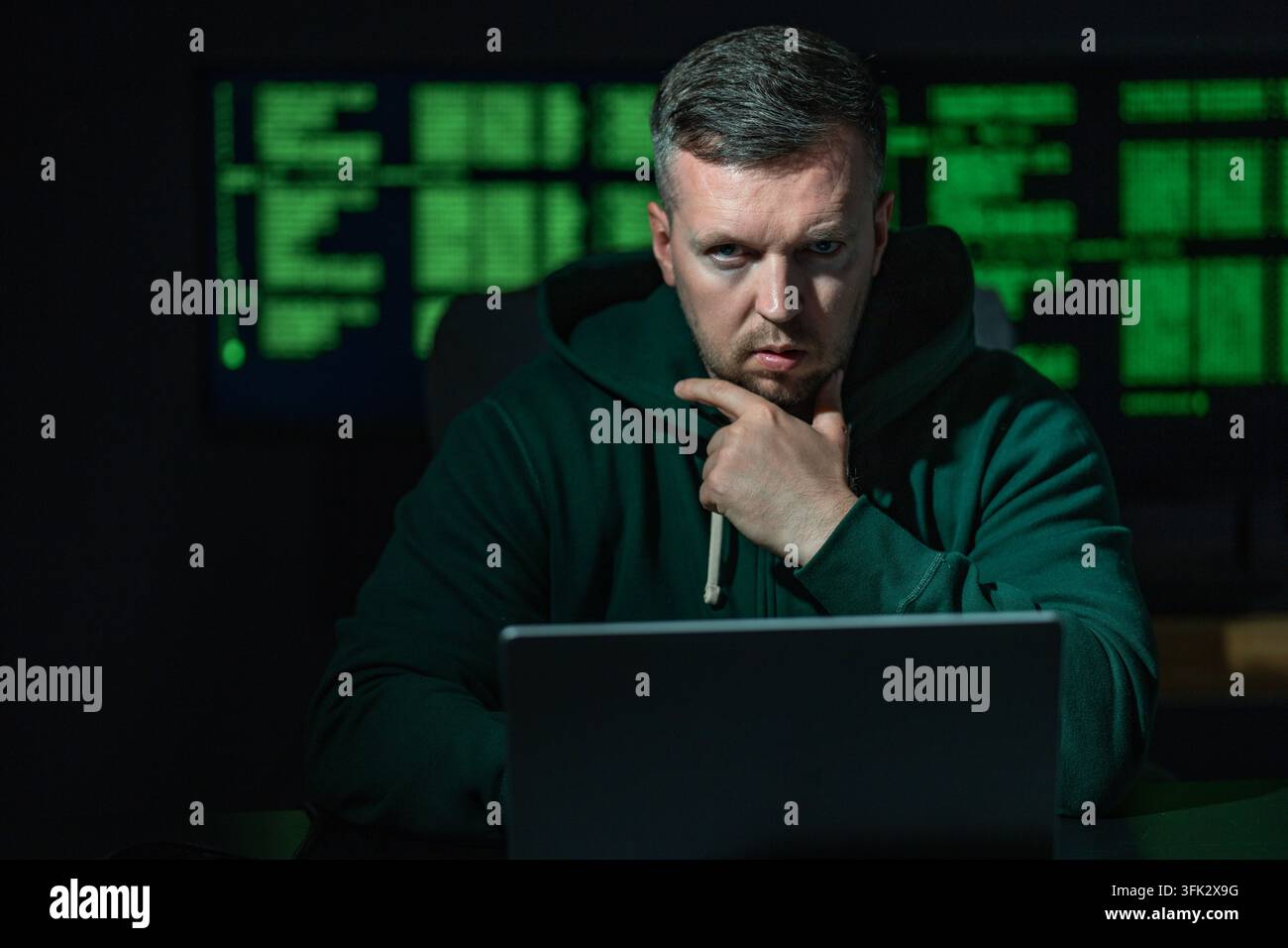 Malware hacker develops malicious software. Malware hacker infects computer network. Malware hacker bypasses security system. Malware hacker spreads Stock Photo