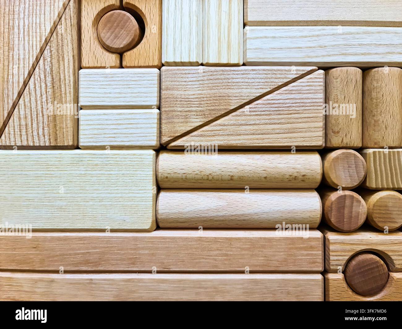 Wooden building blocks form a geometric pattern, representing construction and creativity Stock Photo