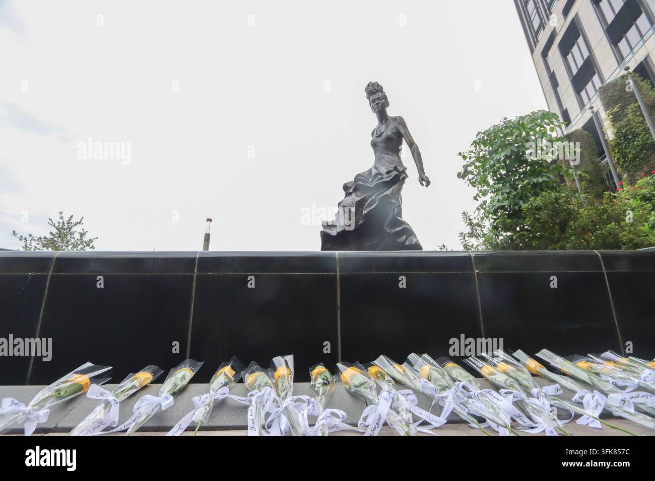 A general view shows the restored bronze statue of the late Canto-pop ...