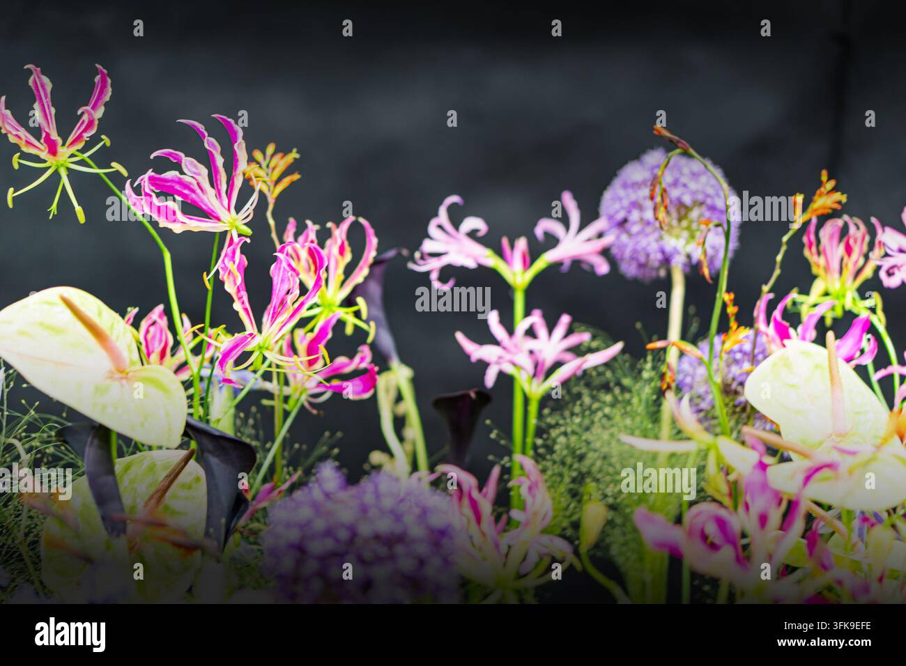 Floral arrangement featuring colorful flowers and foliage, including ...