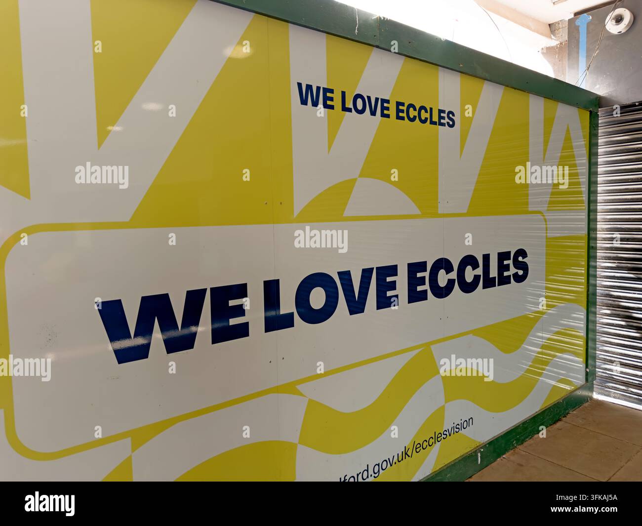 “We Love Eccles” artwork on regeneration hoardings in Eccles town centre, Salford, during redevelopment of the former shopping centre area. Stock Photo