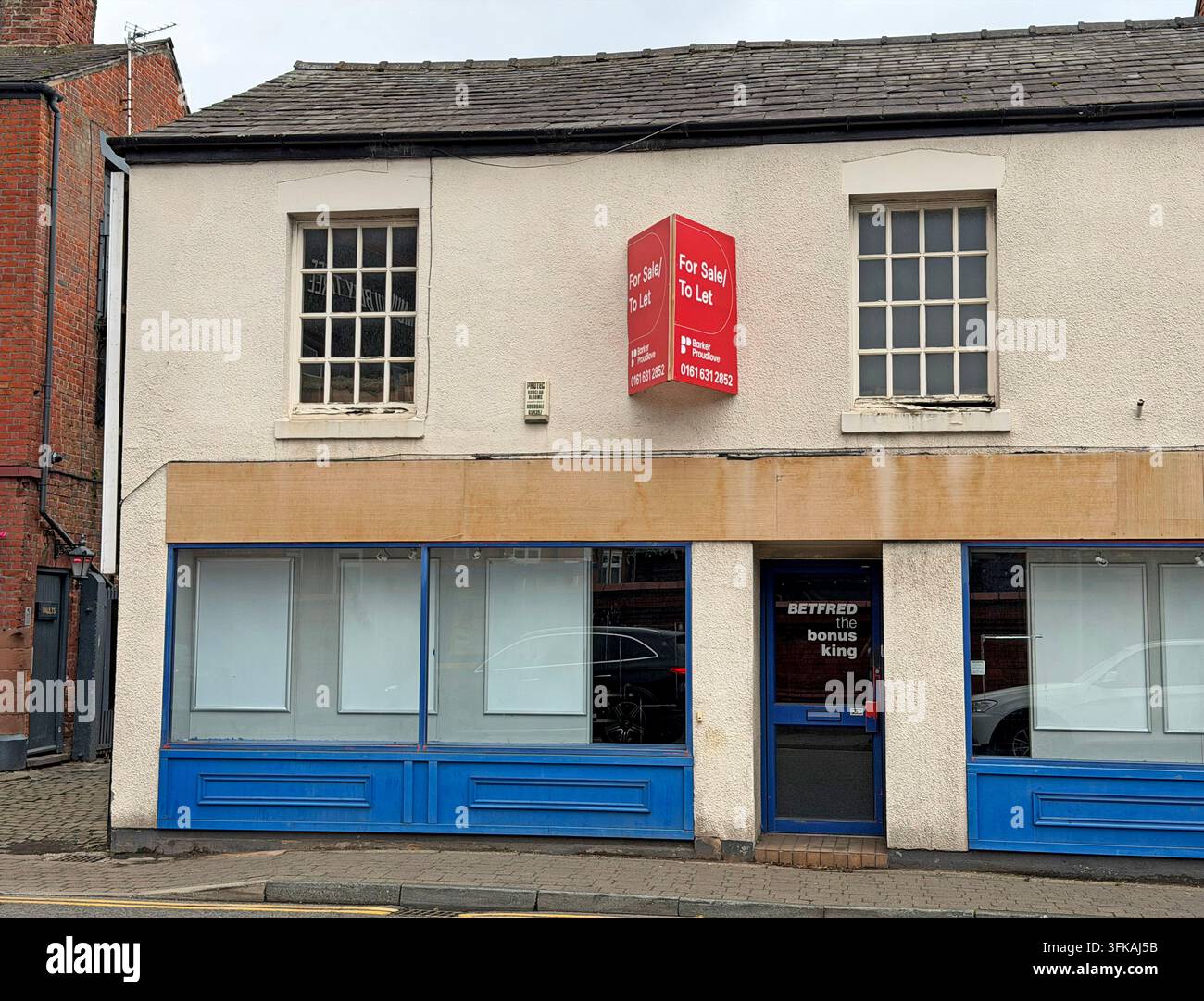 Closed former Betfred betting shop at 54-56 London Road, Stockton Heath, Warrington, offered as vacant high-street retail premises. Stock Photo