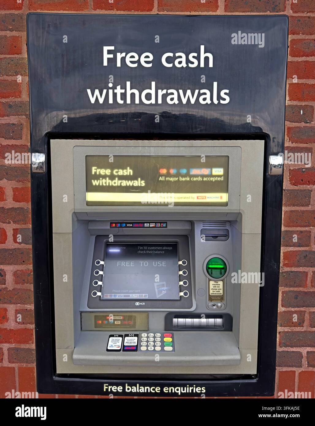 NoteMachine ATM advertising free cash withdrawals, illustrating continued demand for fee-free cash access as banking services move online. Stock Photo