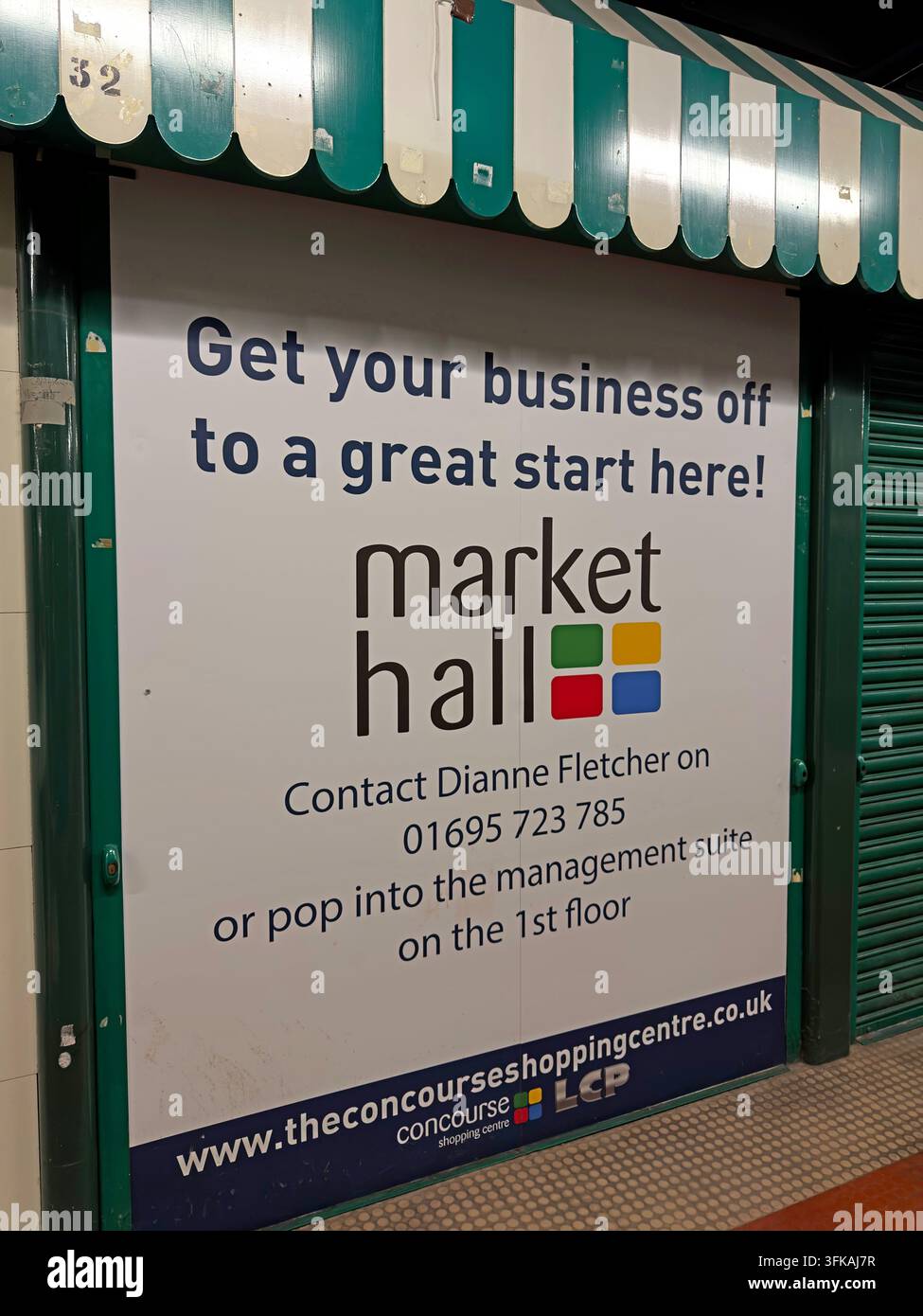 “Get your business off to a great start here” advertising sign at The Concourse Market Hall, Skelmersdale, promoting a vacant market unit. Stock Photo