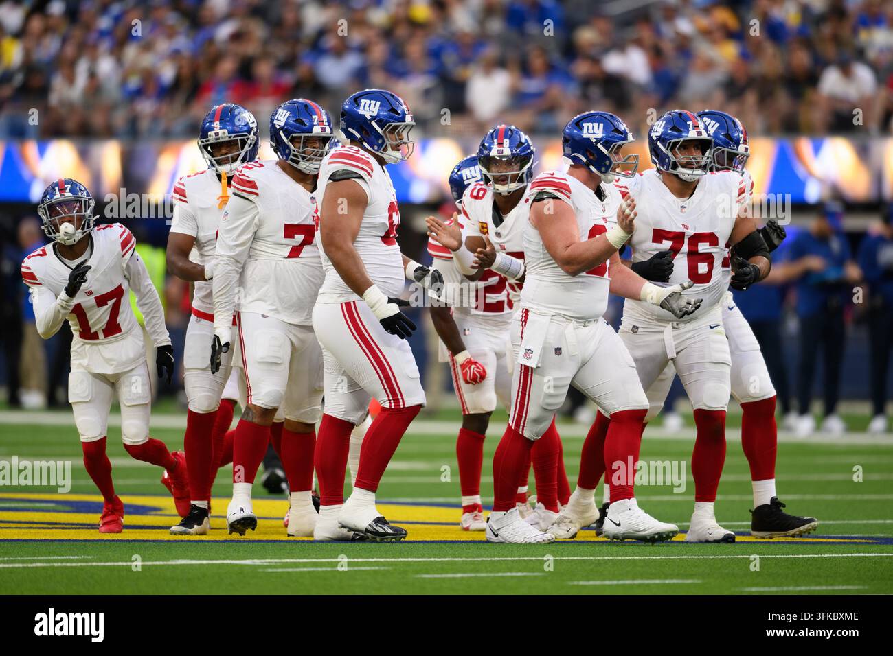 Nfl Rms Logo New York Giants players huddle during an NFL football game against the ...