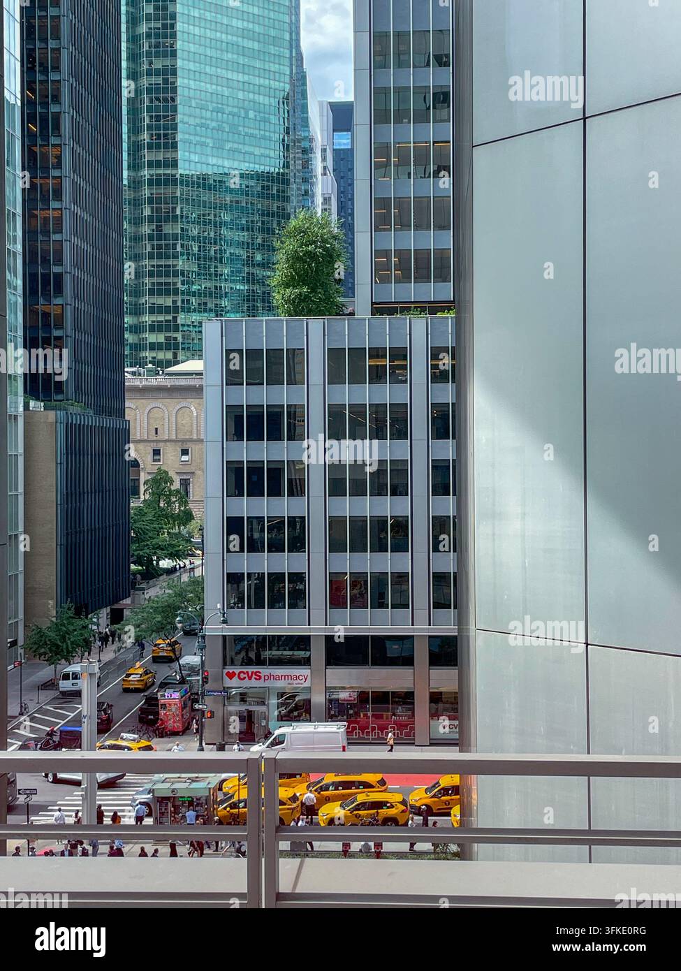 Taxis on Lexington Avenue with Park Avenue Tennis Club one block away, NYC, USA, 2026 - Smartphone Captured Stock Image
