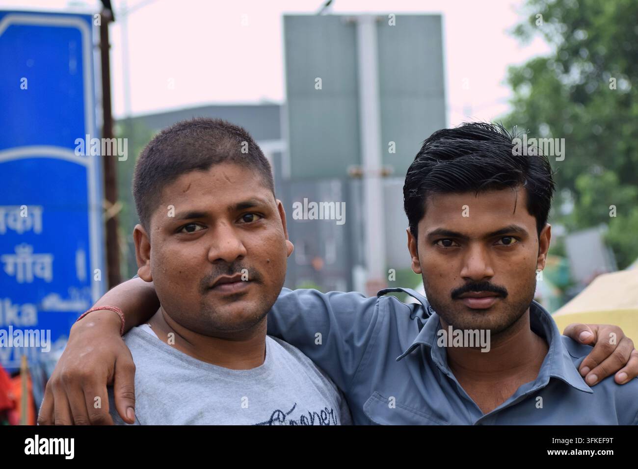 Portrait of two Indian men standing together outdoors. Stock Photo