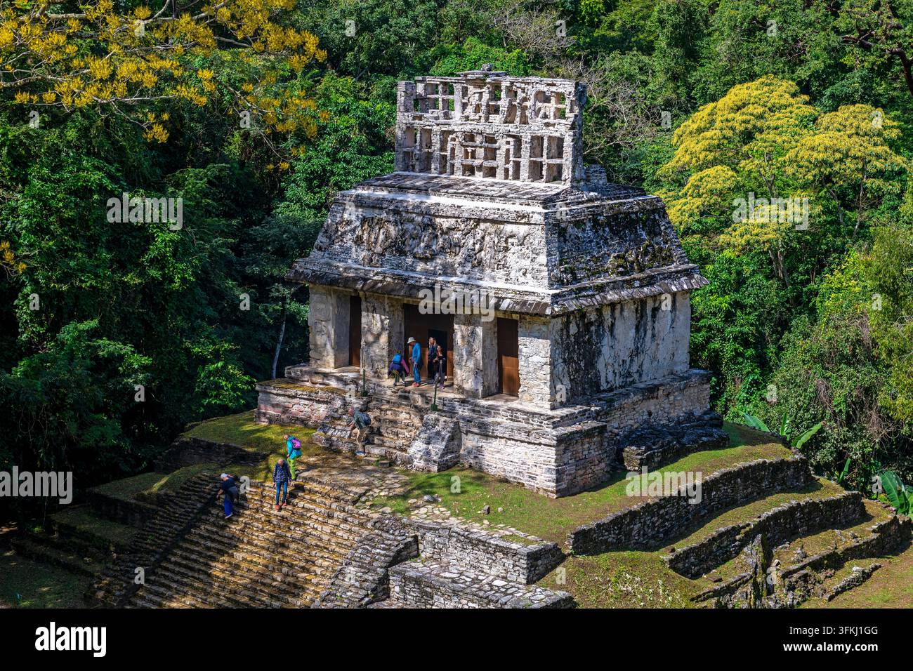 People by the Maya Sun Temple in the Chiapas rainforest, Palenque, Mexico. Stock Photo