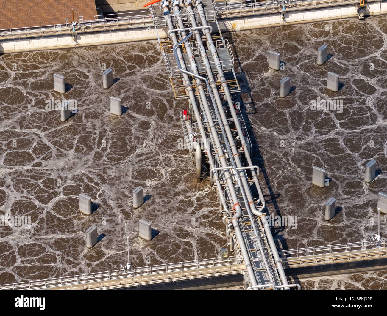 Aerial close up of complex piping and aeration tanks at a Pennsylvania ...