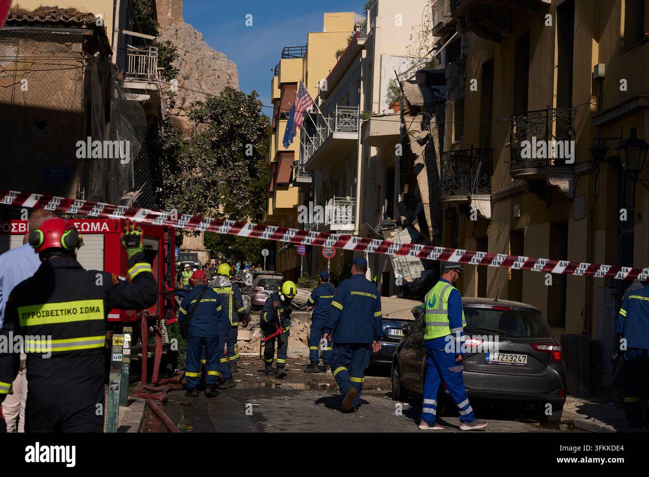 Firefighters work at the scene following a powerful blast that caused a ...