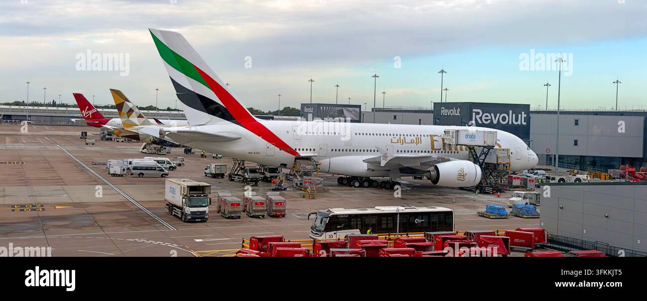Emirates Airbus A380 wide-body aircraft being serviced on the apron at Manchester Airport, England. Stock Photo