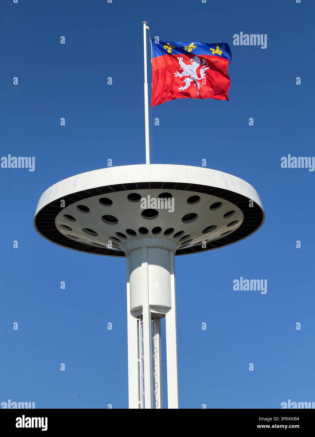 Flag of the City of Lyon flying from one of the distinctive towers beside the Rhône in Lyon, France. Stock Photo