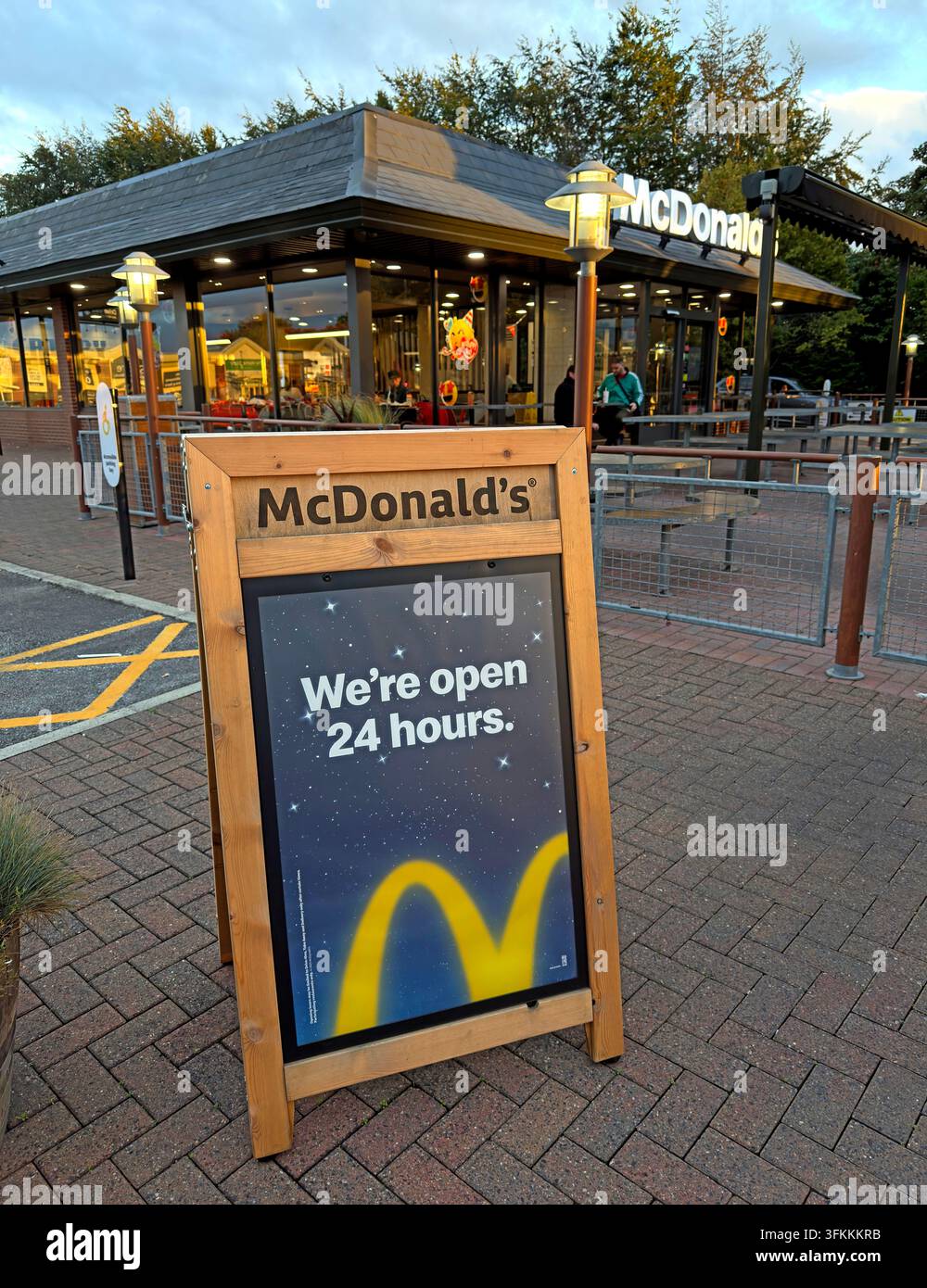 McDonald's open-24-hours A-board at Riverside Retail Park in Warrington. Stock Photo