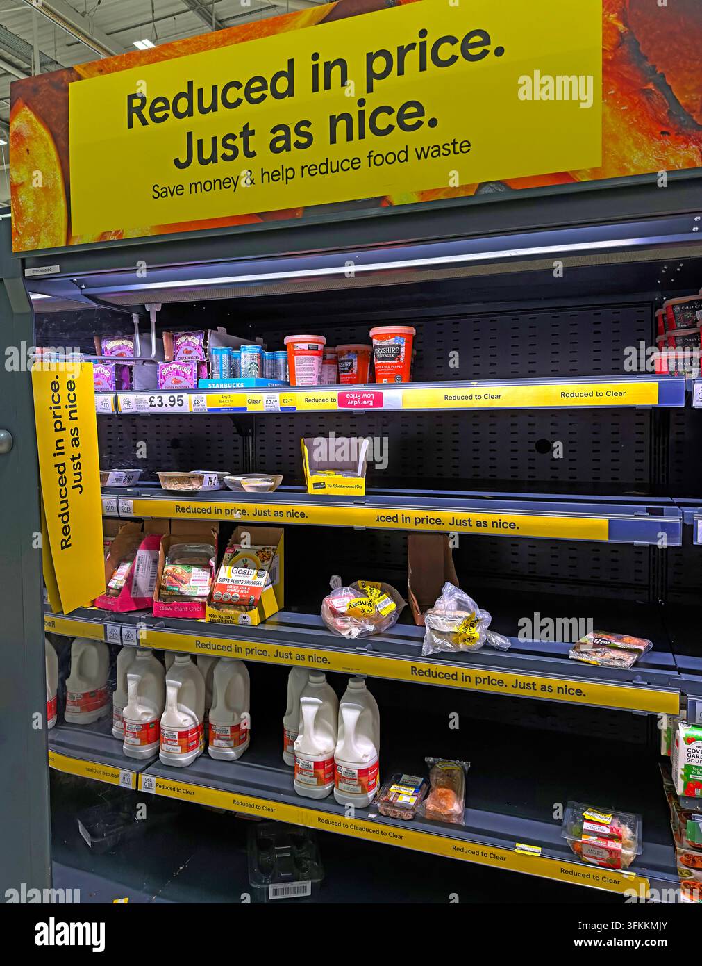 Reduced in price. Just as nice: yellow sticker supermarket discounts highlight cost-of-living pressures, bargain hunting and food waste reduction Stock Photo