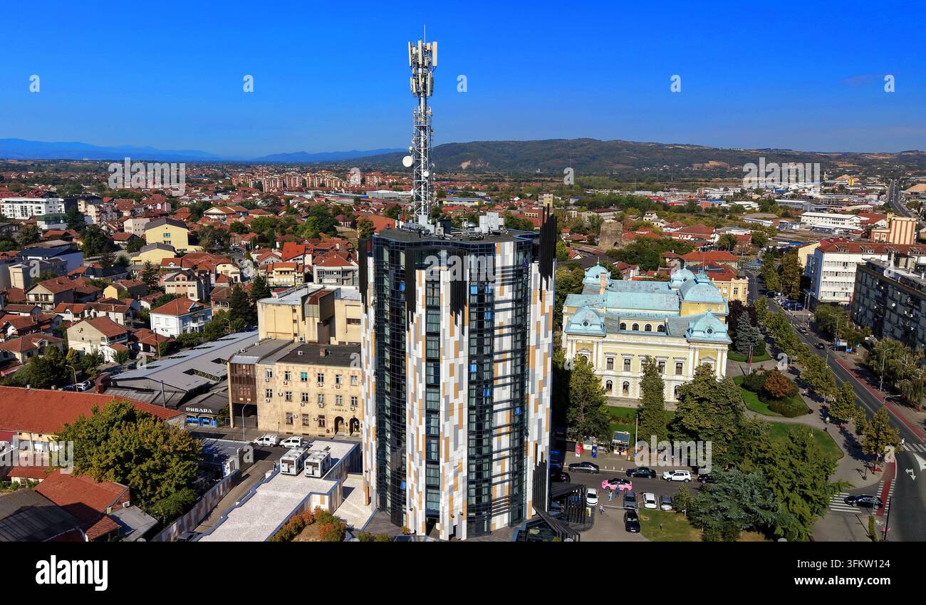 Aerial view of a modern high-rise building featuring a ...
