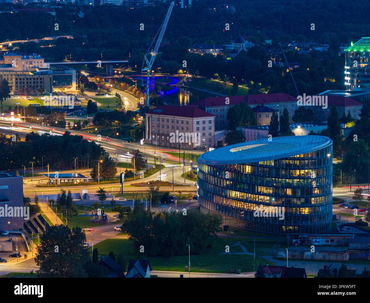 Aerial view of the modern illuminated office building in the city ...