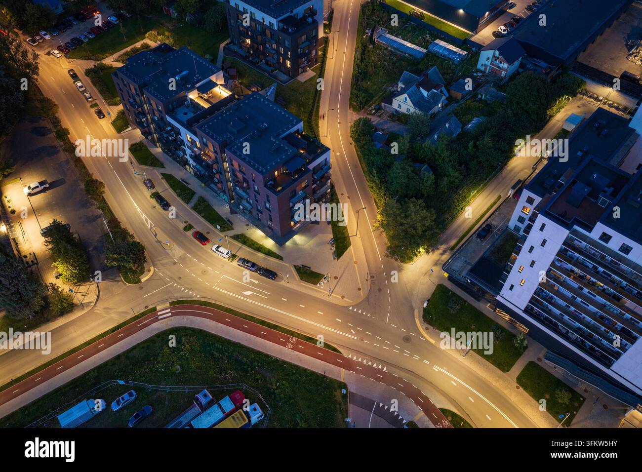 Aerial view of a modern urban intersection at night with contemporary ...