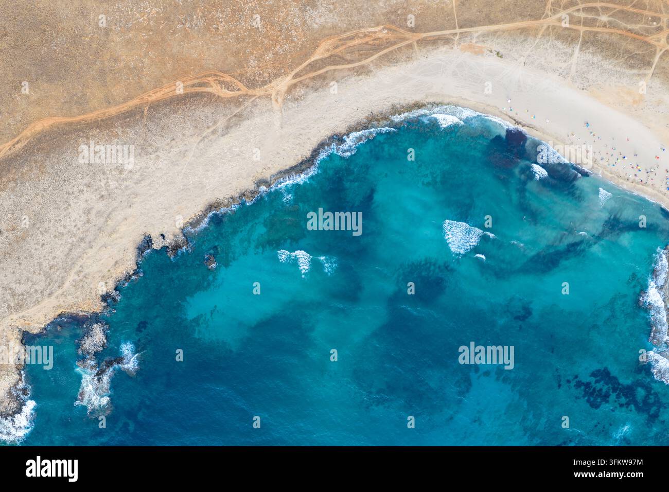 Aerial view of the turquoise waters and rocky coastline of Riserva ...