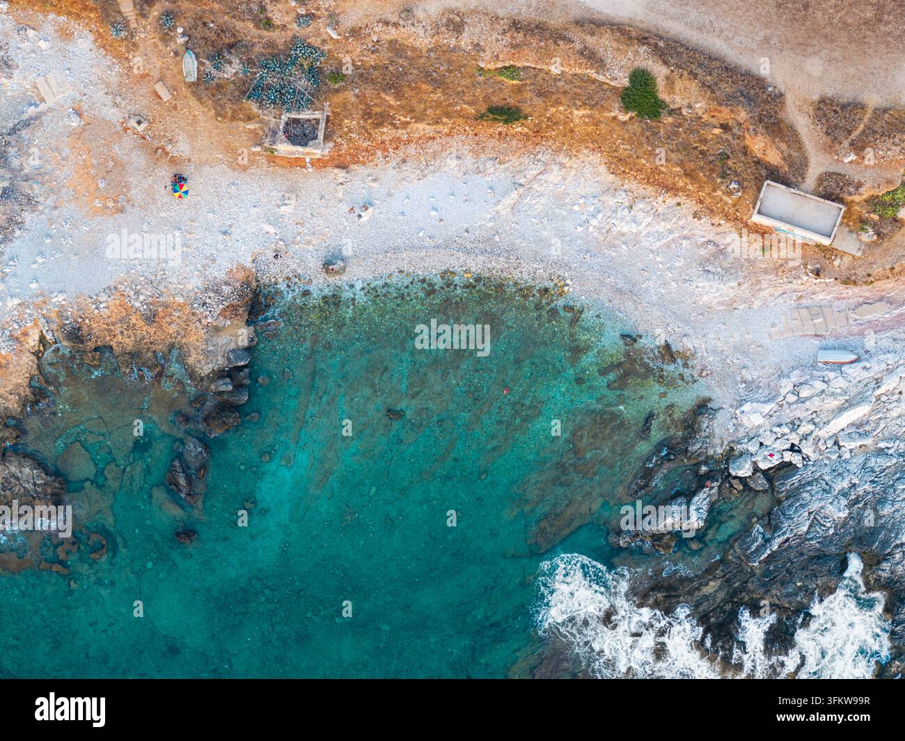 Aerial view of the turquoise waters and rocky coastline of Riserva ...