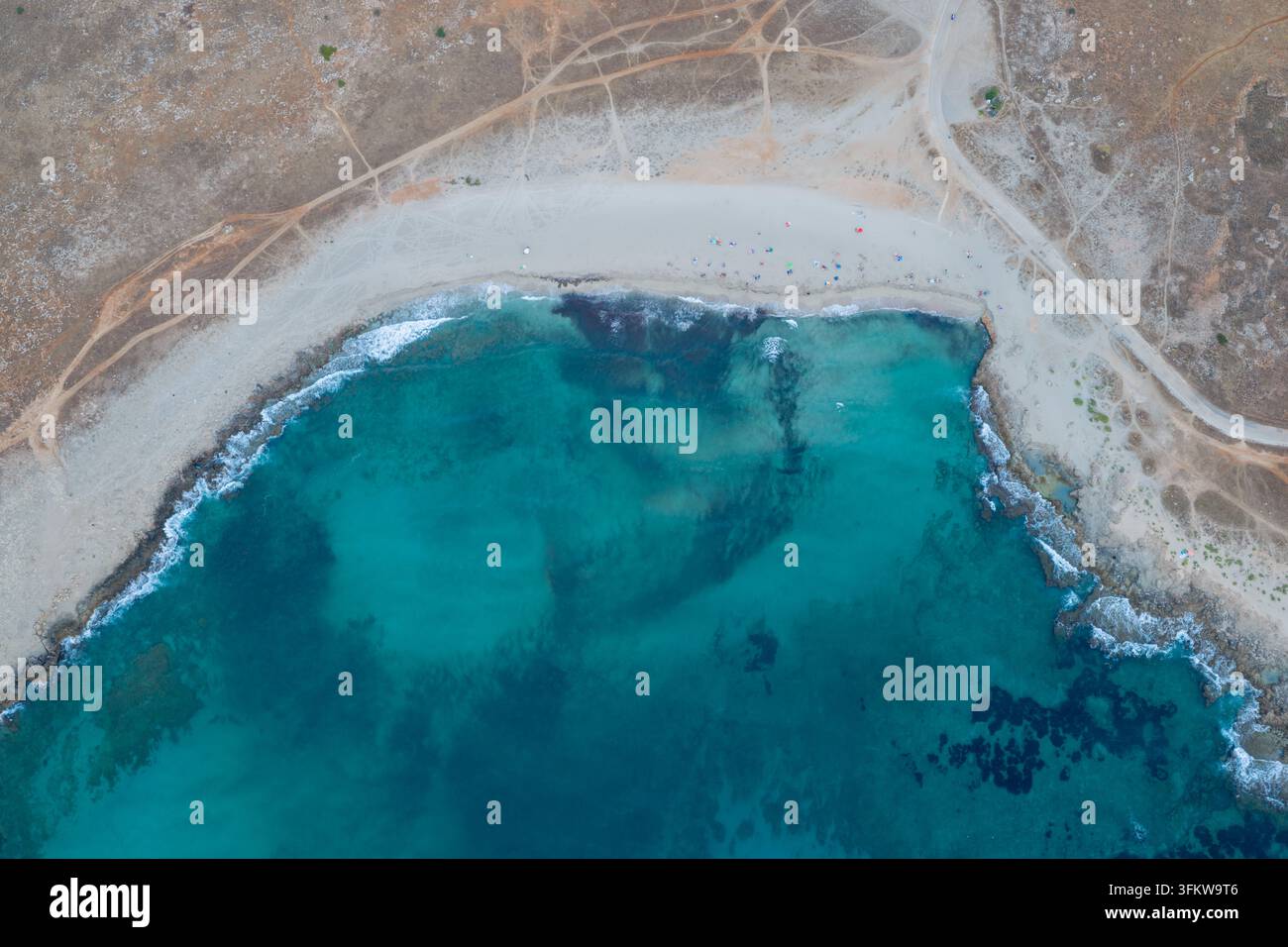 Aerial view of the turquoise waters and rocky coastline of Riserva ...