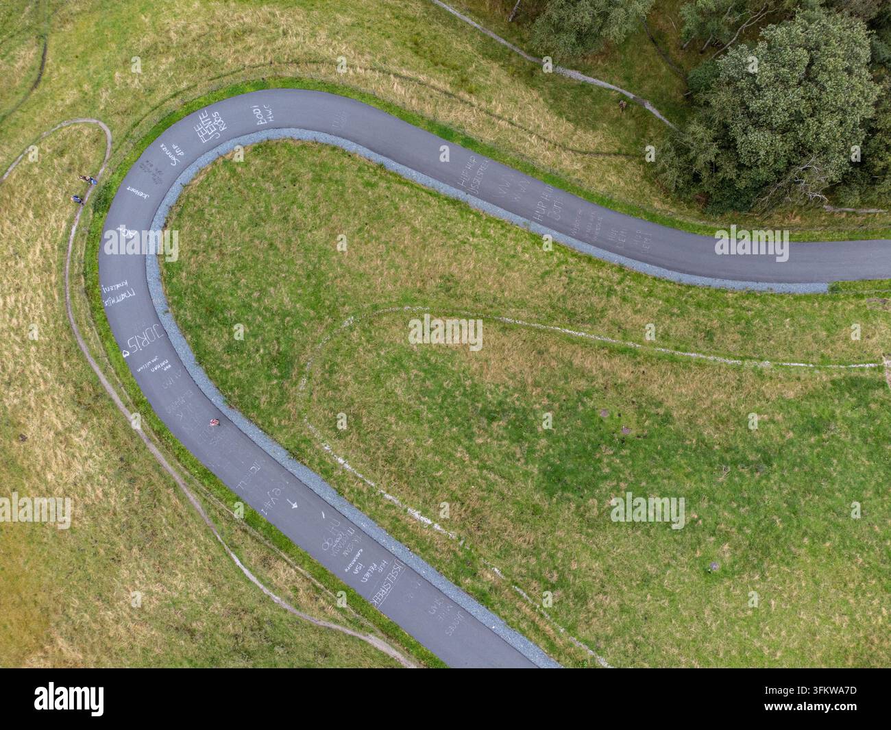 Aerial view of Col du Vam, a winding cycling road surrounded by lush ...