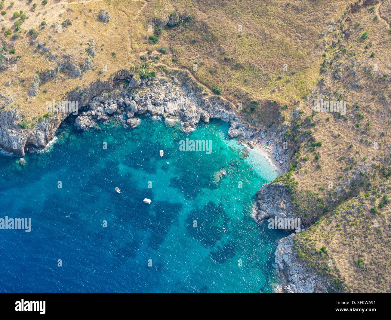 Aerial view of the turquoise waters and rocky coastline of Riserva ...