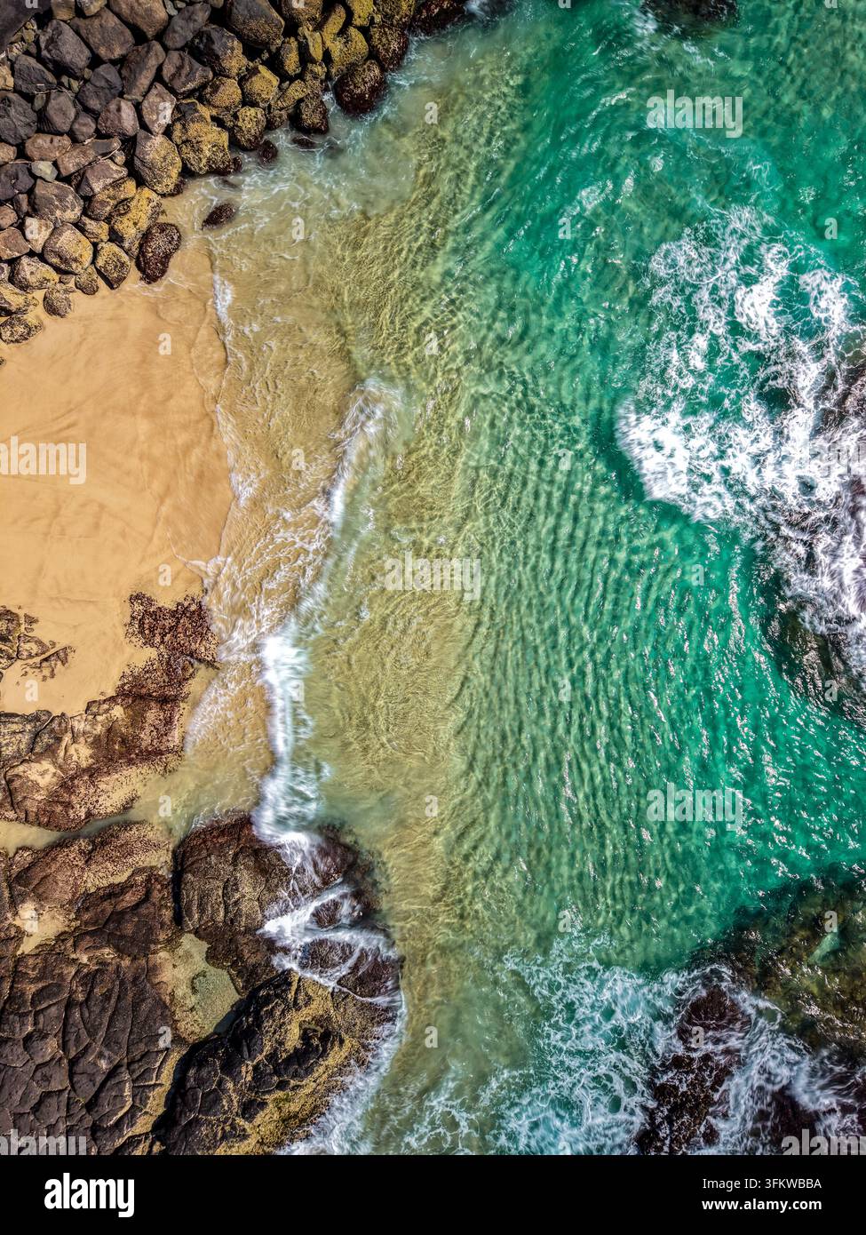 Aerial View Rocks Aerial view of turquoise waters and rocky shoreline at Cudgen Headland ...