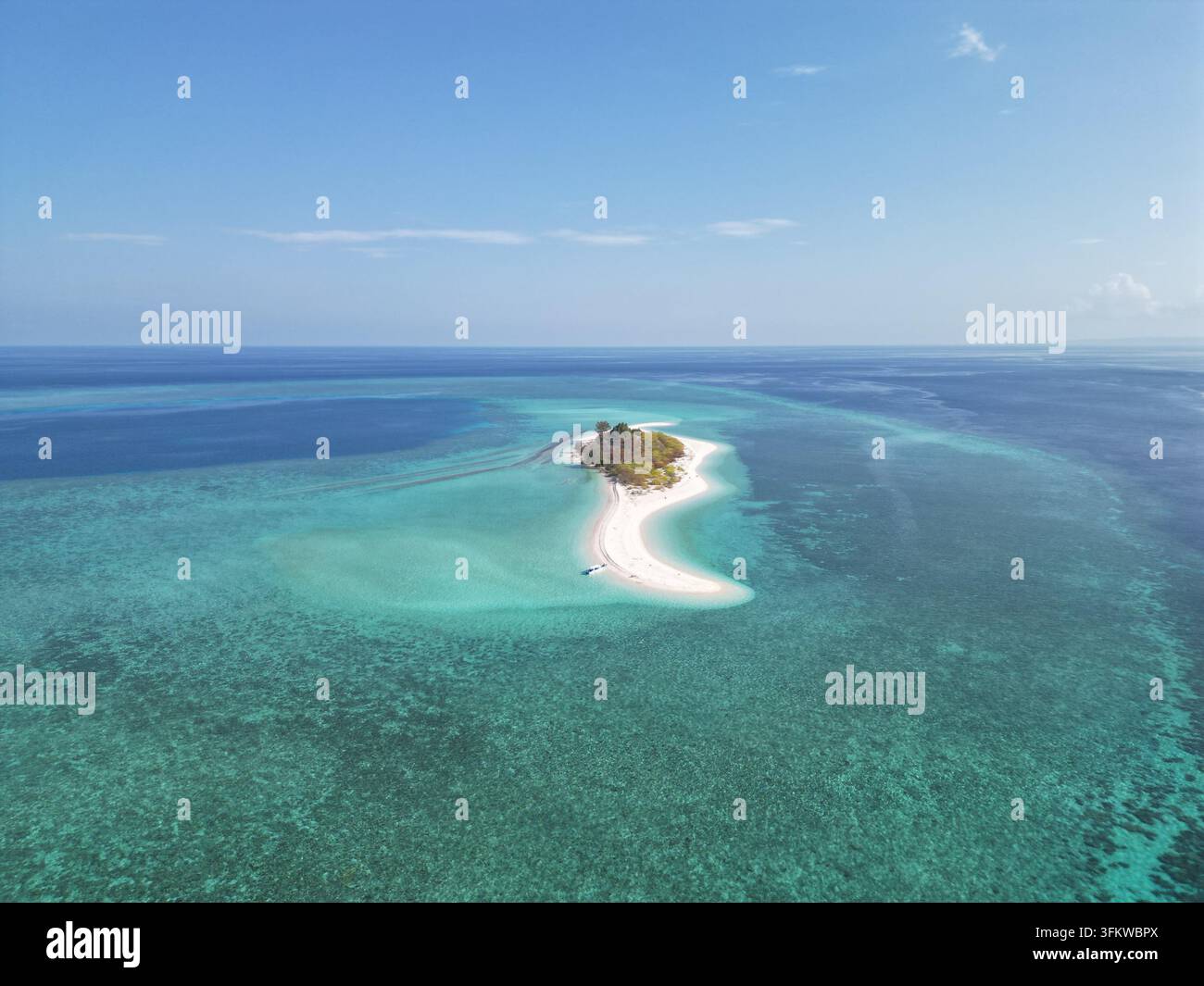 Aerial view of Pulau Ndaa, a small tropical island with a white sand ...