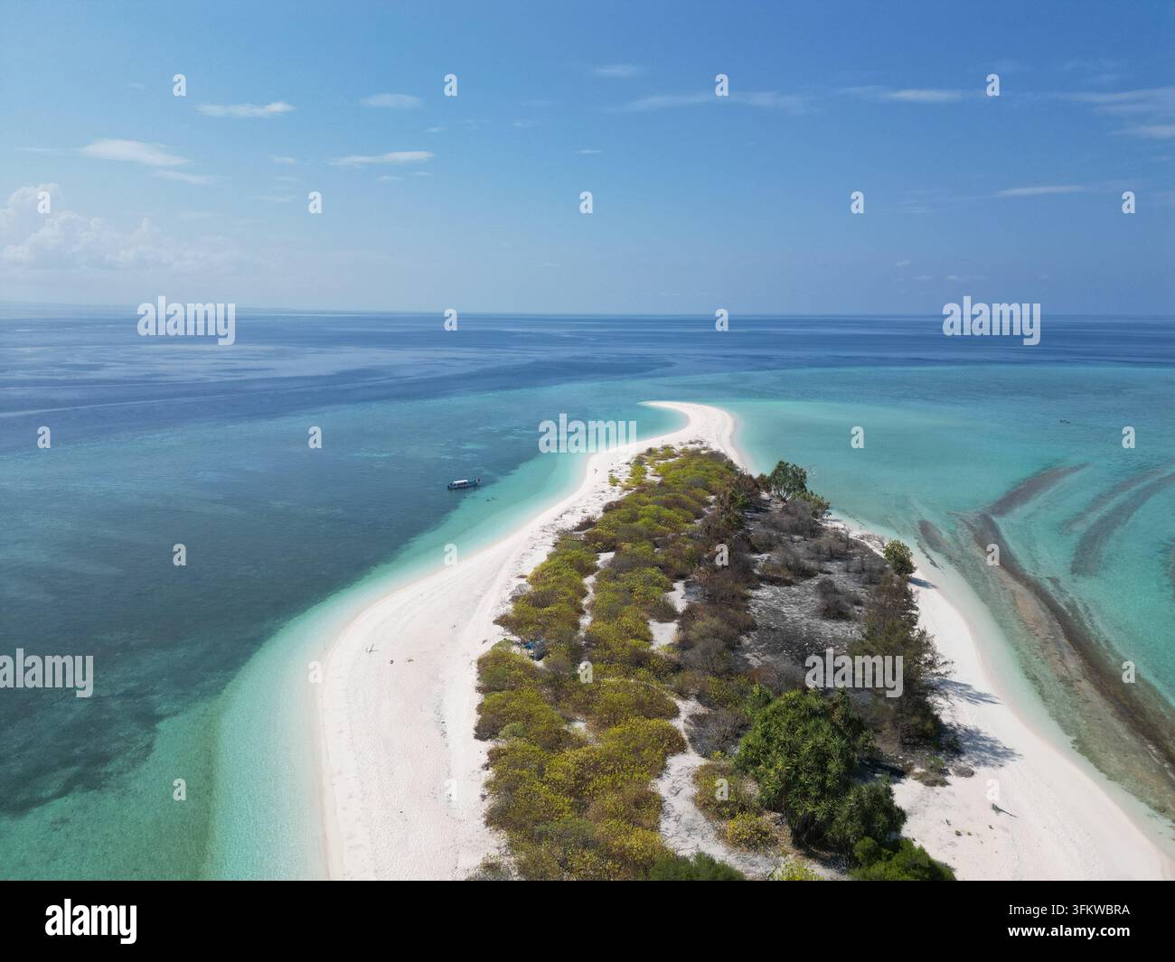 Aerial view of Pulau Ndaa, a small tropical island with white sand ...