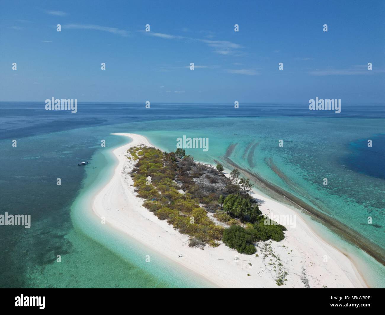 Aerial view of Pulau Ndaa, a small tropical island with white sand ...