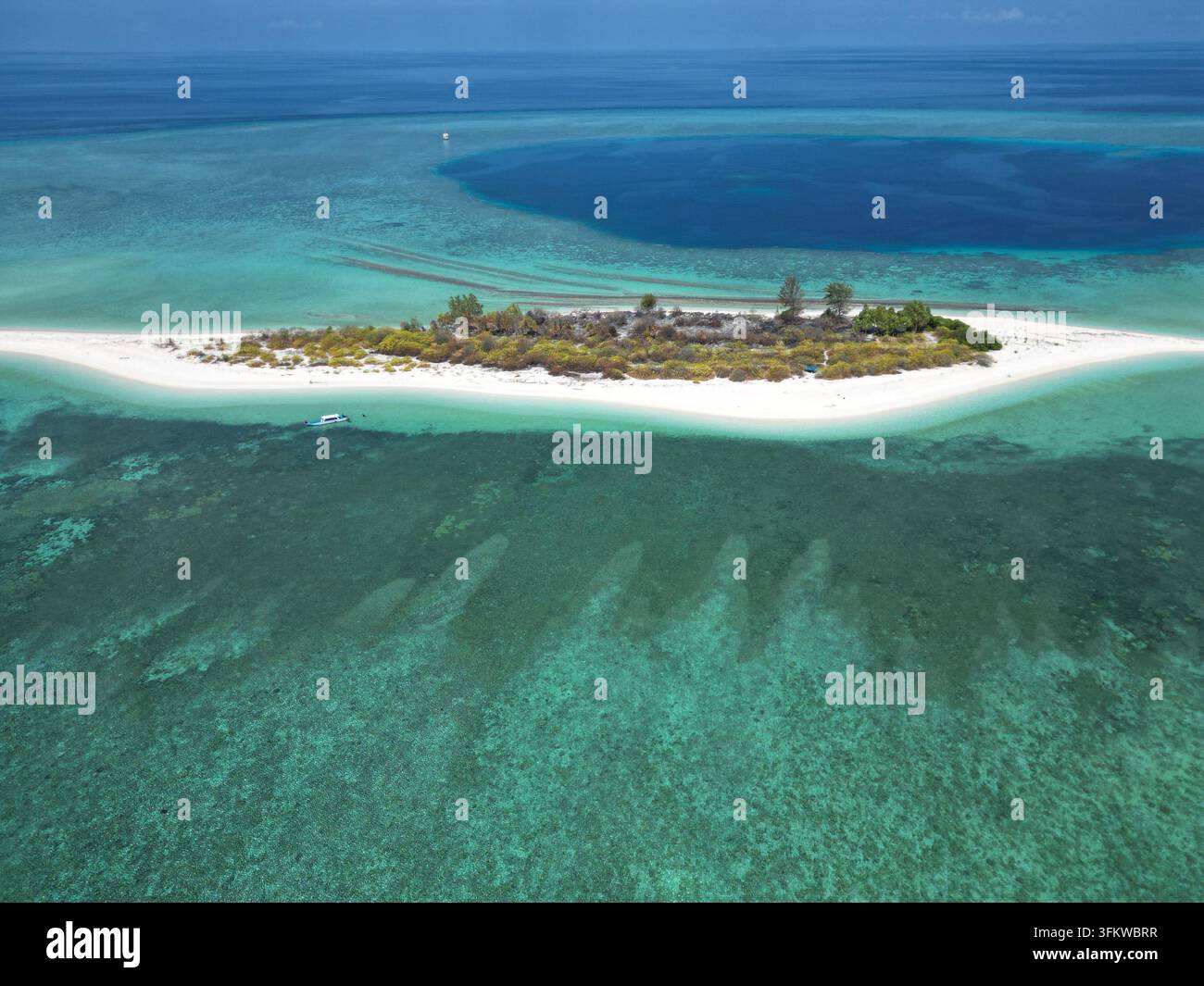 Aerial view of Pulau Ndaa, a small tropical island with white sand ...