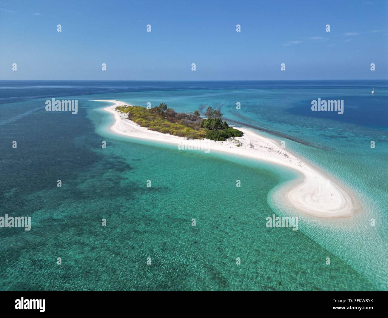 Aerial view of Pulau Ndaa, a small tropical island with white sand ...