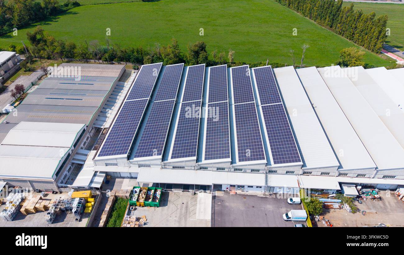 Aerial view of a large distribution center featuring extensive solar ...