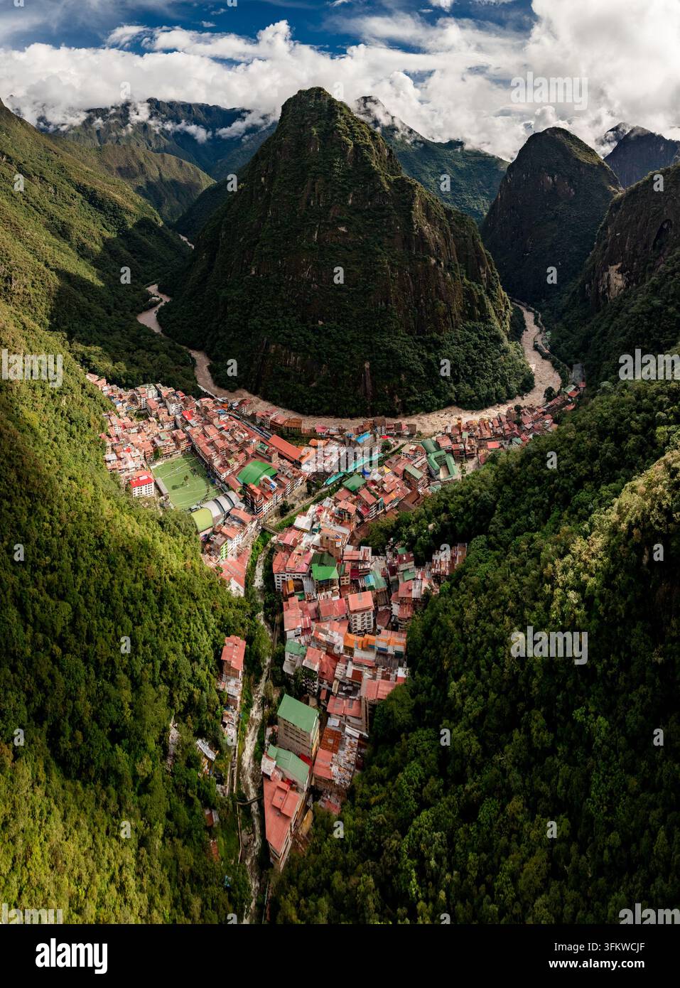 Aerial view of the town of Aguas Calientes nestled in a deep valley ...