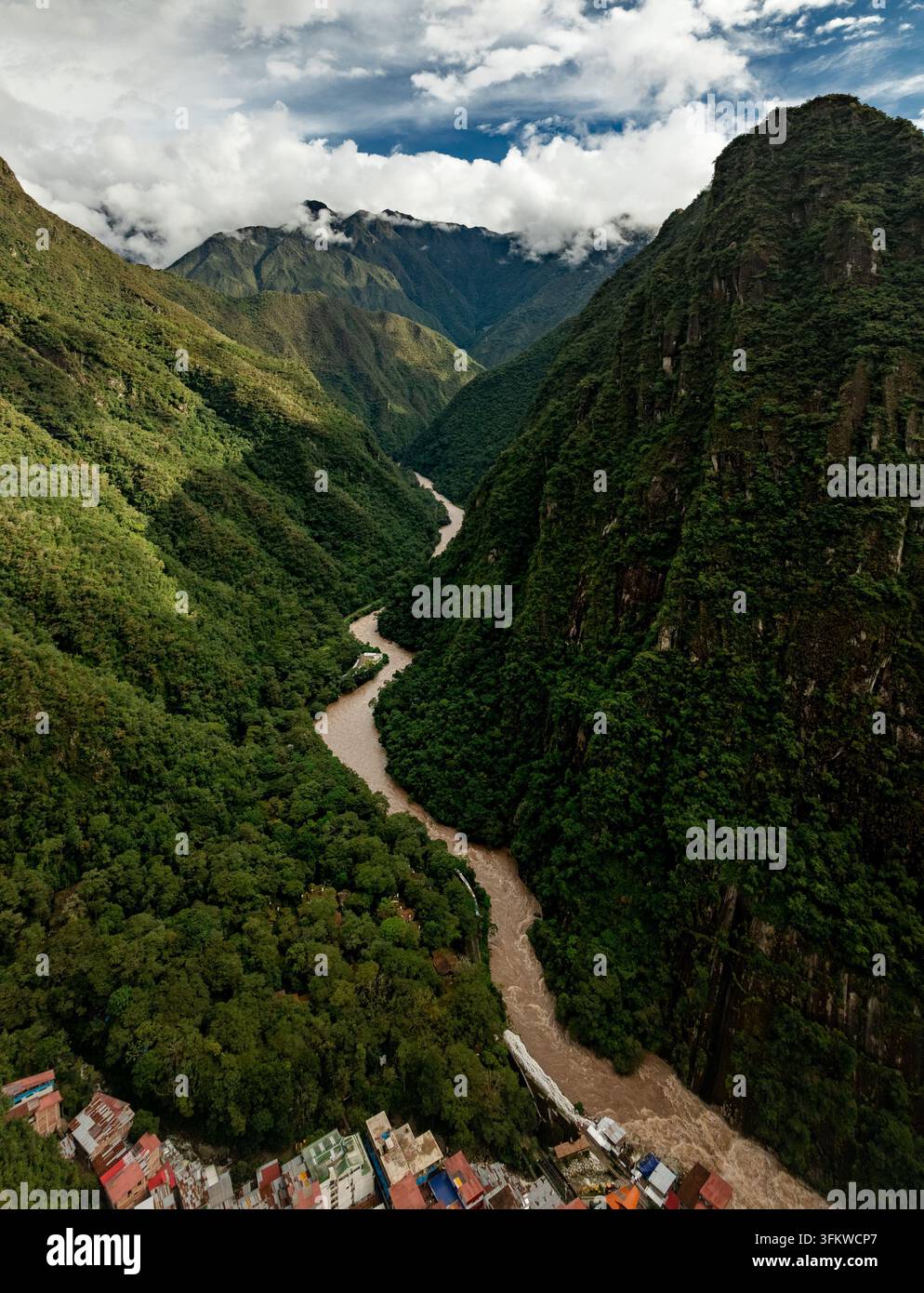 Aerial view of the Urubamba River winding through a deep, lush green ...