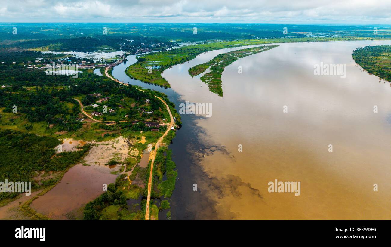 Aerial view of the Cross River flowing through the lush green landscape ...