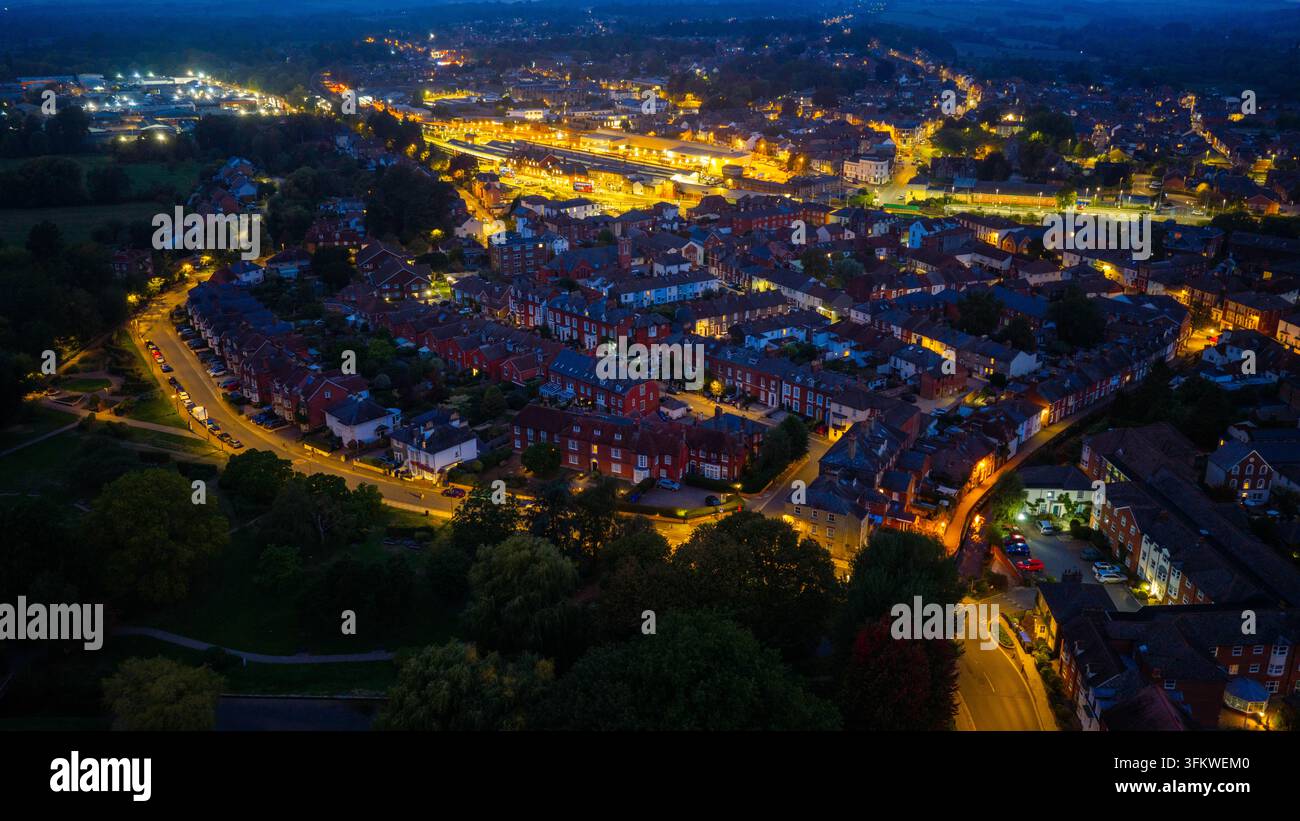 Aerial view of the illuminated streets and residential rooftops of ...