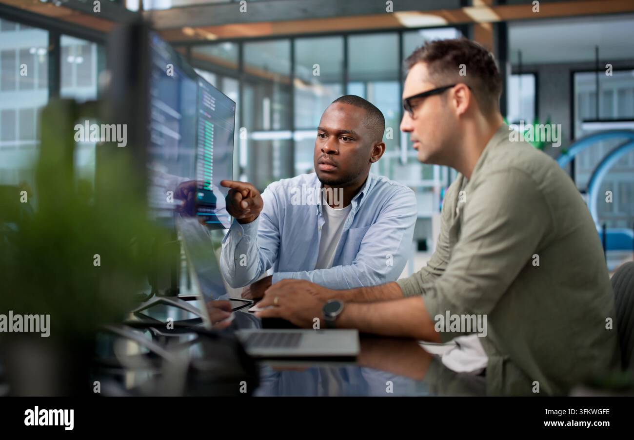 Software Developer Collaborates With Team Using Cloud-based Coding Workspace. Stock Photo