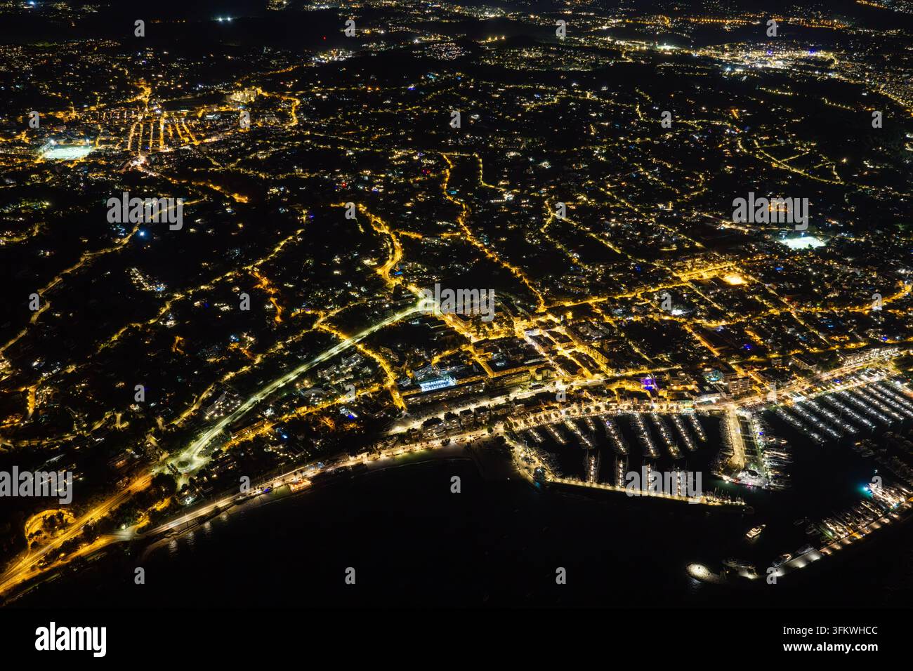Aerial view of the illuminated marina and city lights of Antibes at ...