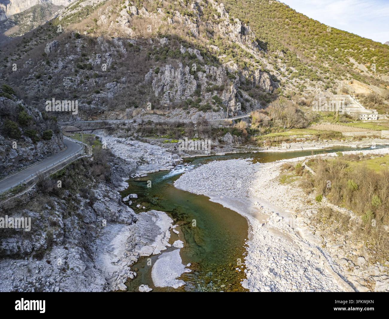 Aerial view of the Lume i Kirit river winding through a rugged mountain ...